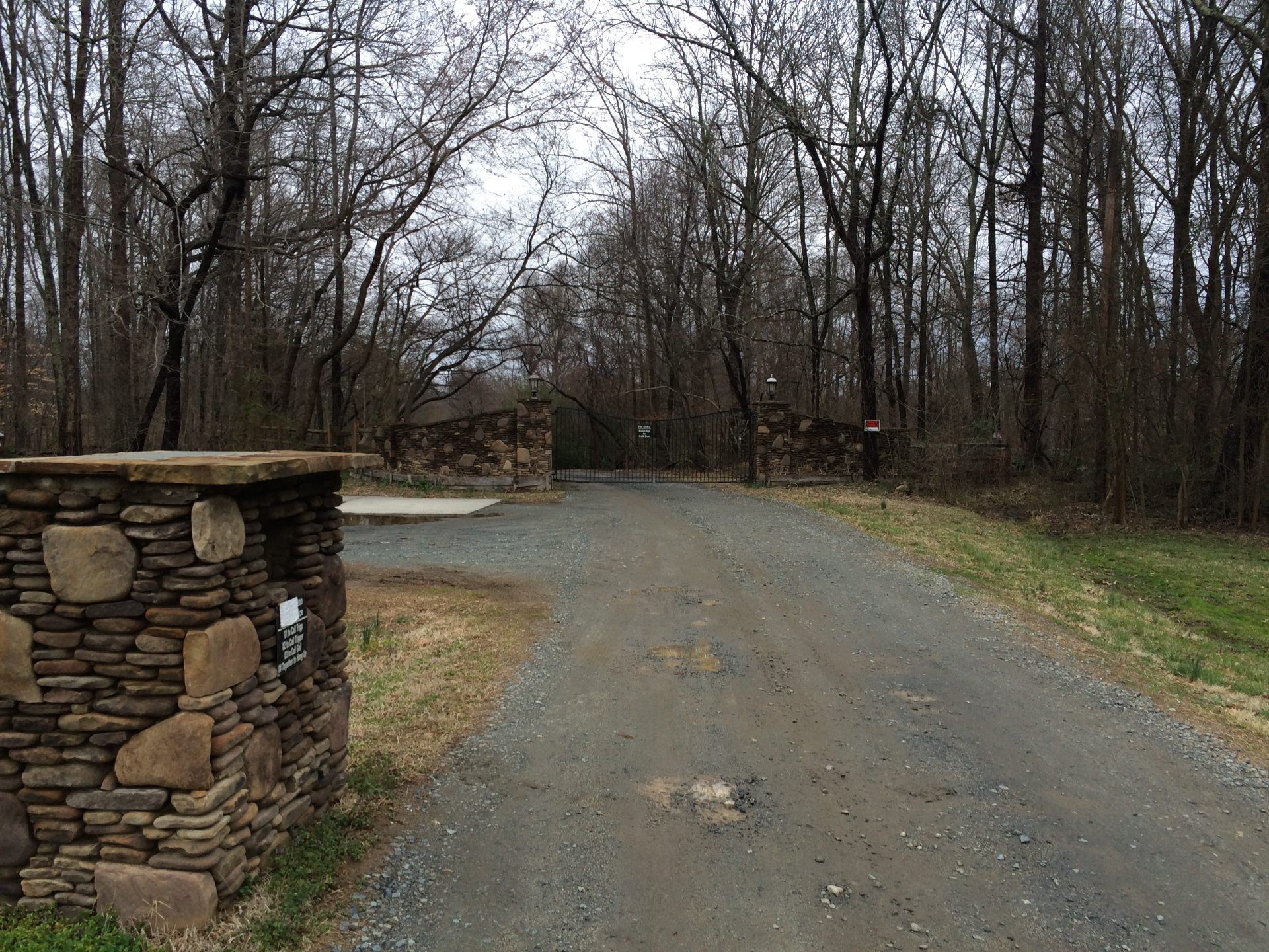 Gated stone entrance to LabPups boarding facility