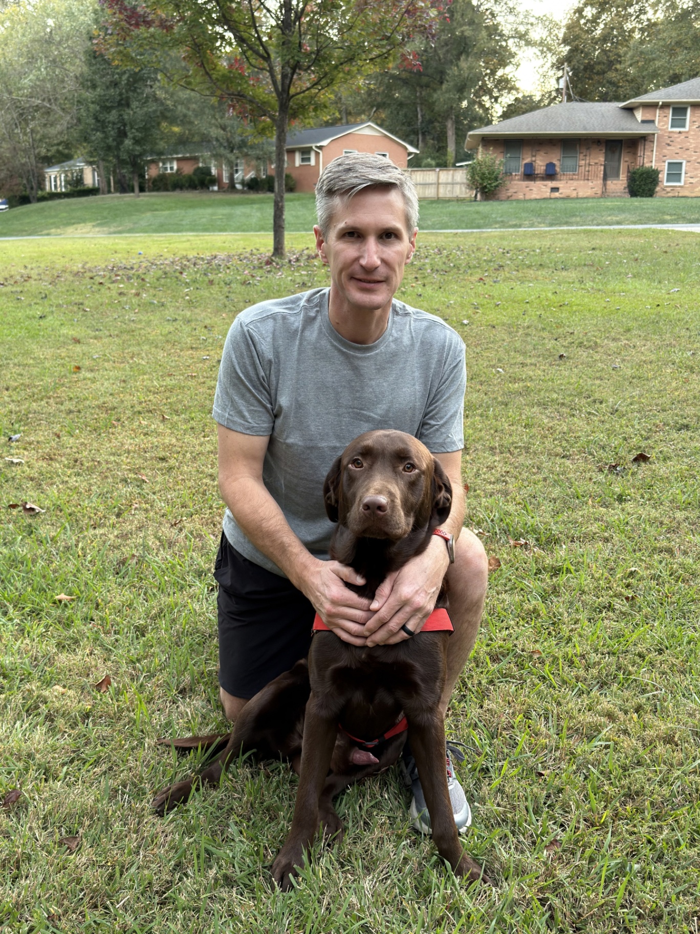 Tripper with his chocolate lab Moose